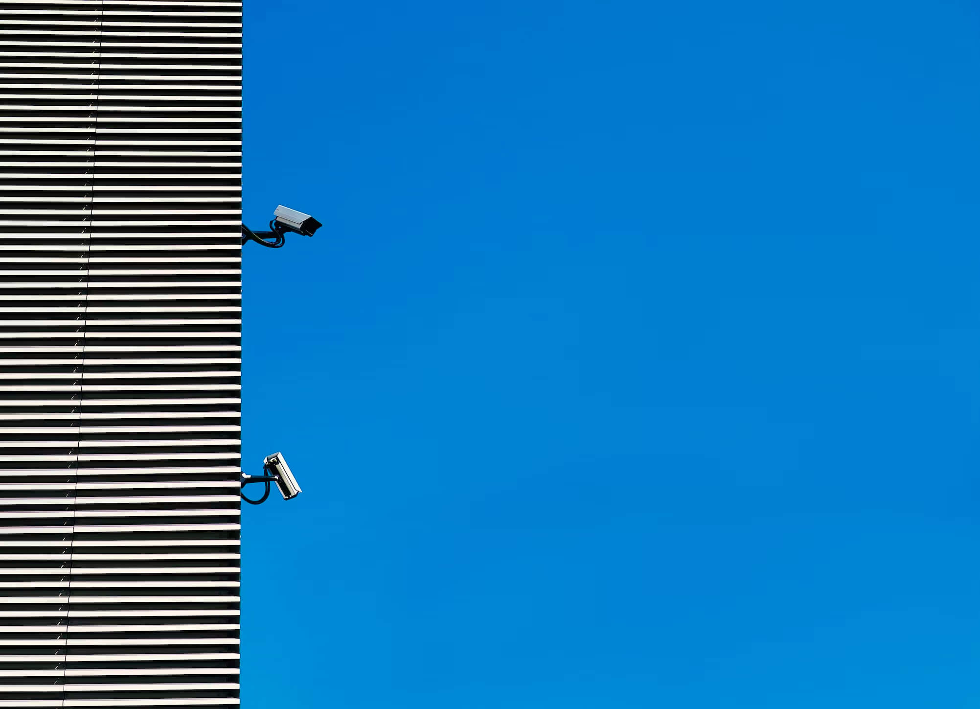 Security cameras against a blue background.